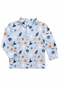 Flat lay of the Mila & Rose Spooky Season boys' long-sleeve polo, showing ghosts, black cats, witch hats, cauldrons, broomsticks, bats and jack-o'-lanterns on a light blue ground.